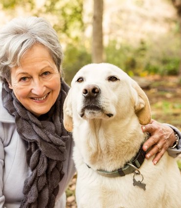 grandma with her cute lab dog